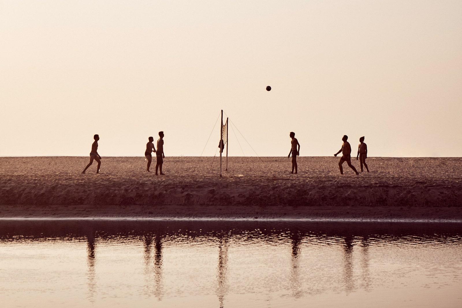 Playing volleyball on Ashvem Beach Goa